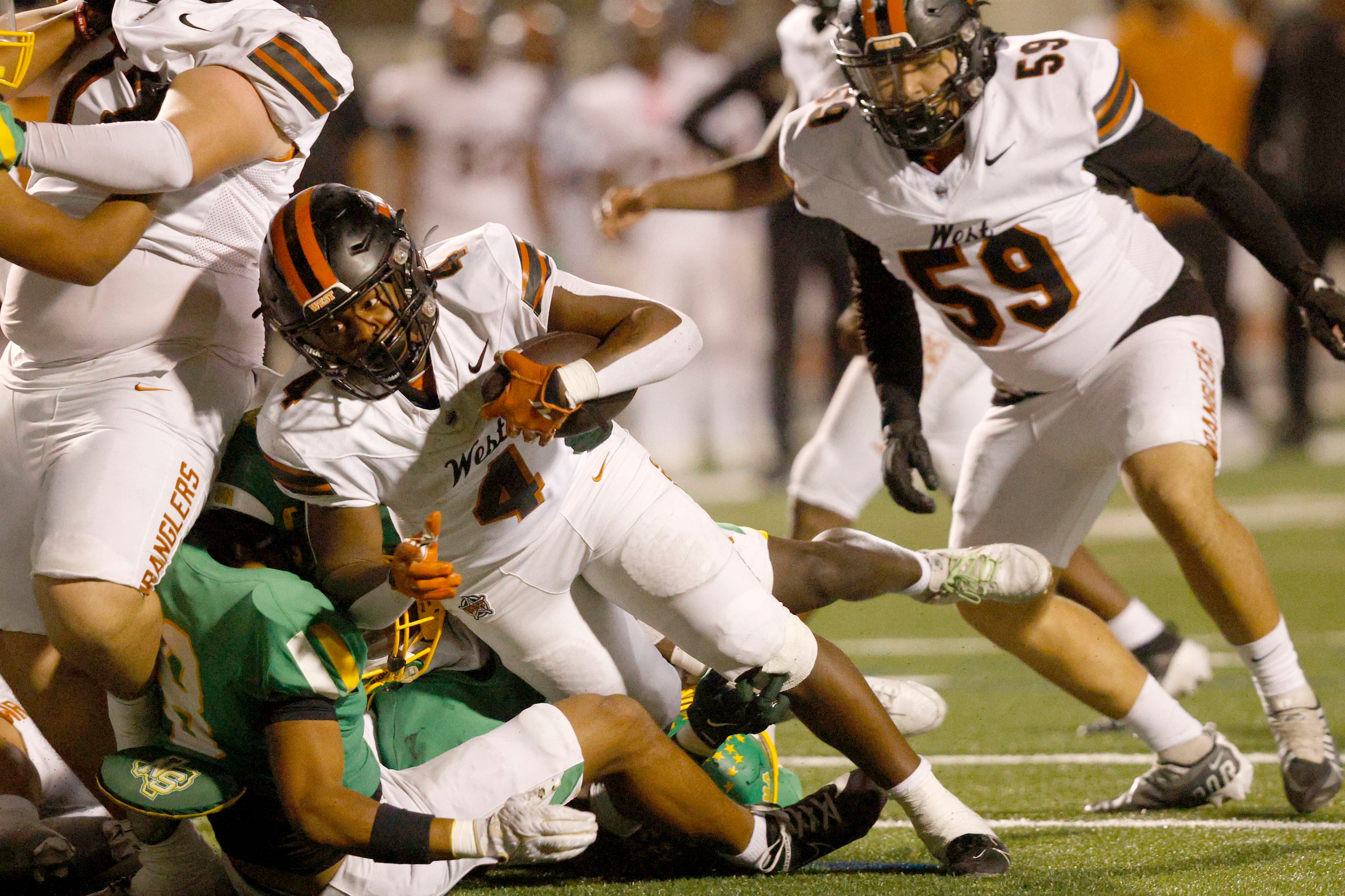 West Mesquite's Damarian Robinson (4) scores a touchdown over Newman Smith in the second...