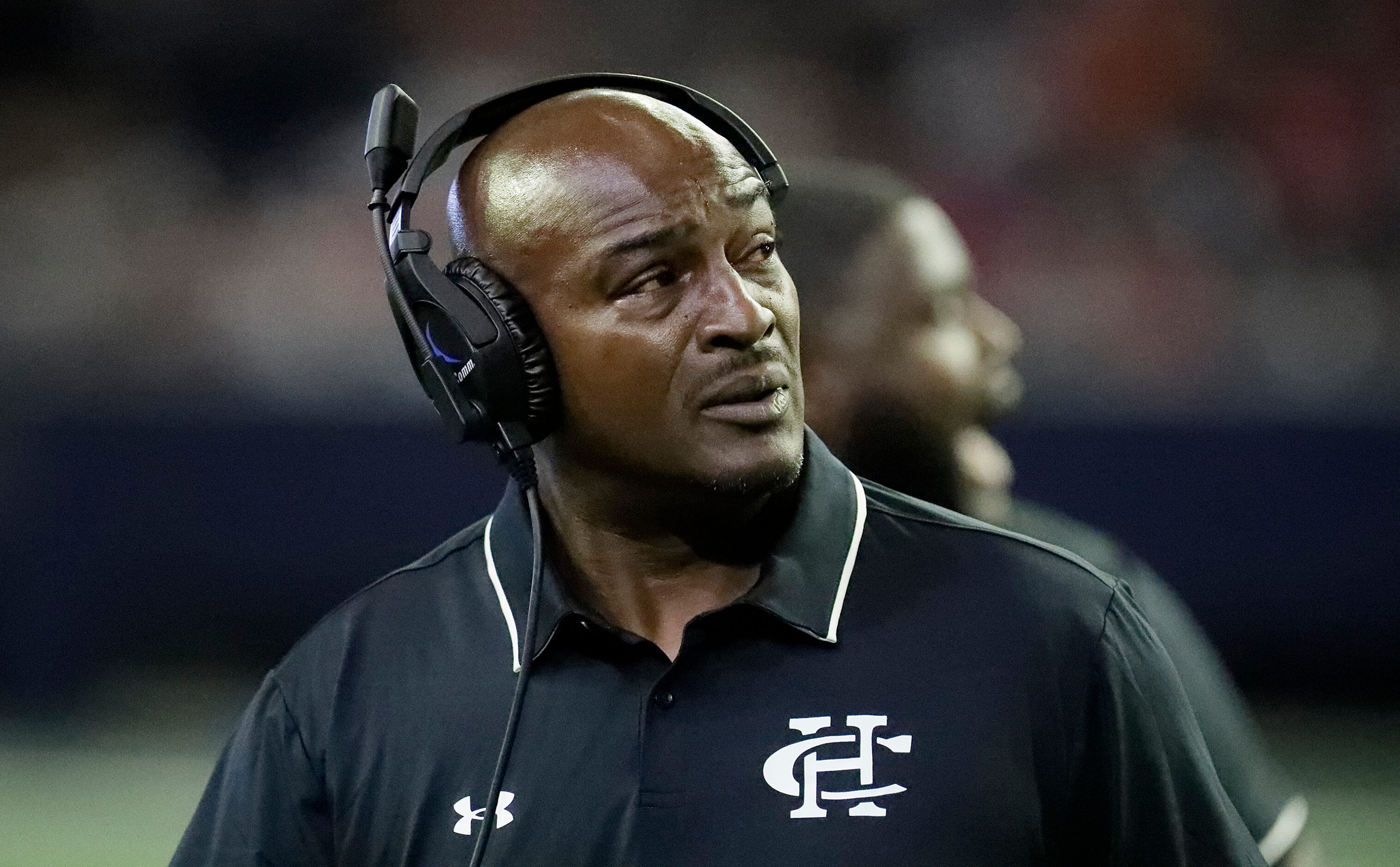 Cedar Hill High School head coach Nick Ward looks at a replay during the first half as...