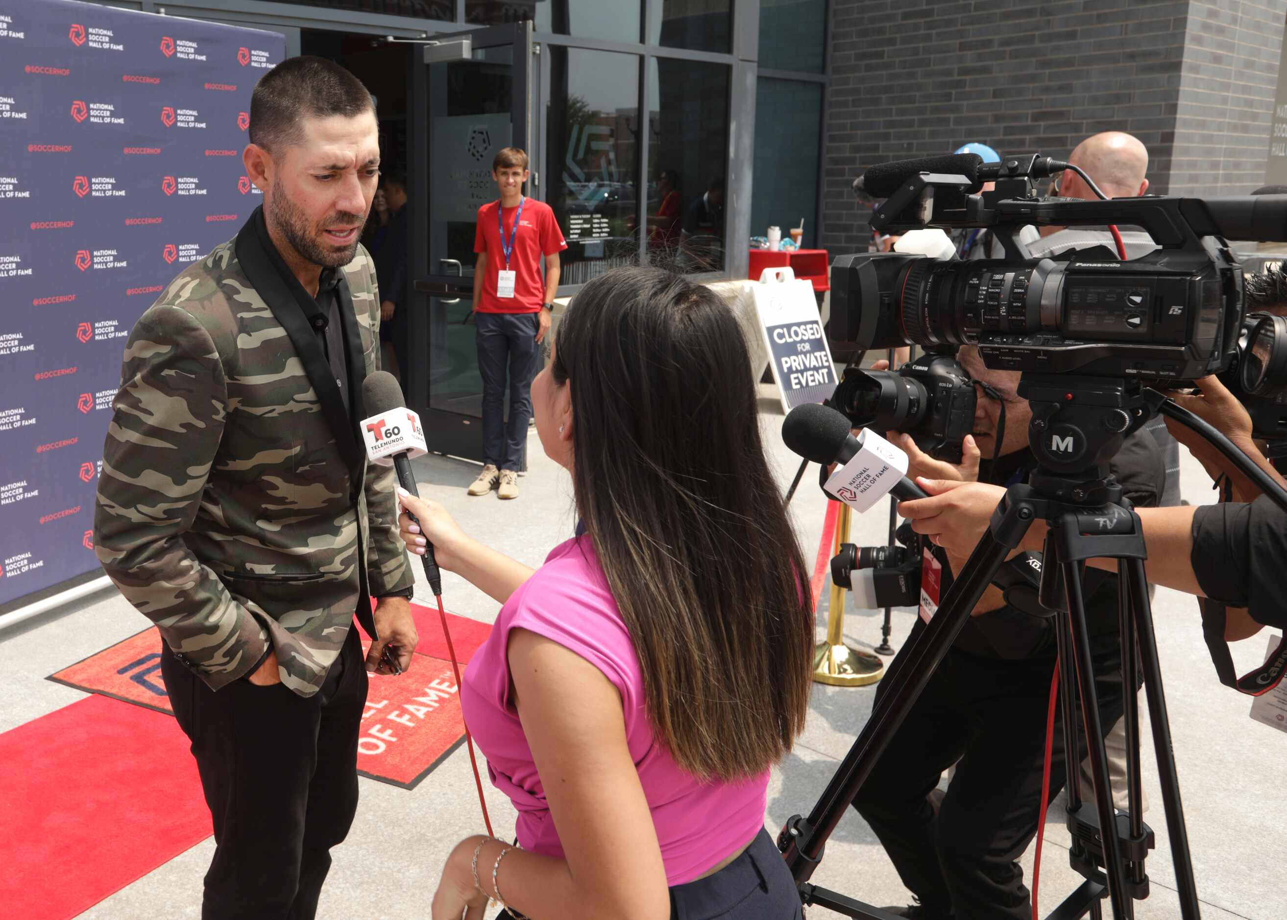 Clint Dempsey does an interview on the red carpet during the National Soccer Hall of Fame...