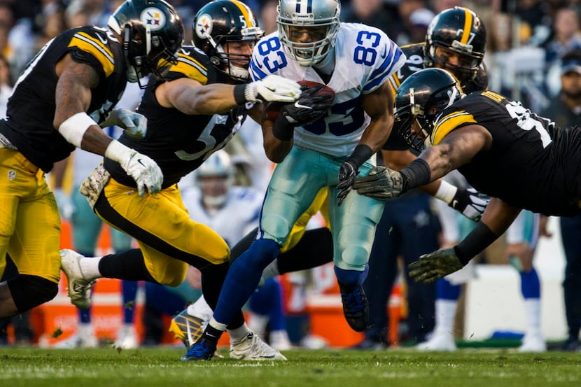 Dallas Cowboys wide receiver Terrance Williams (83) is tackled by Pittsburgh Steelers...