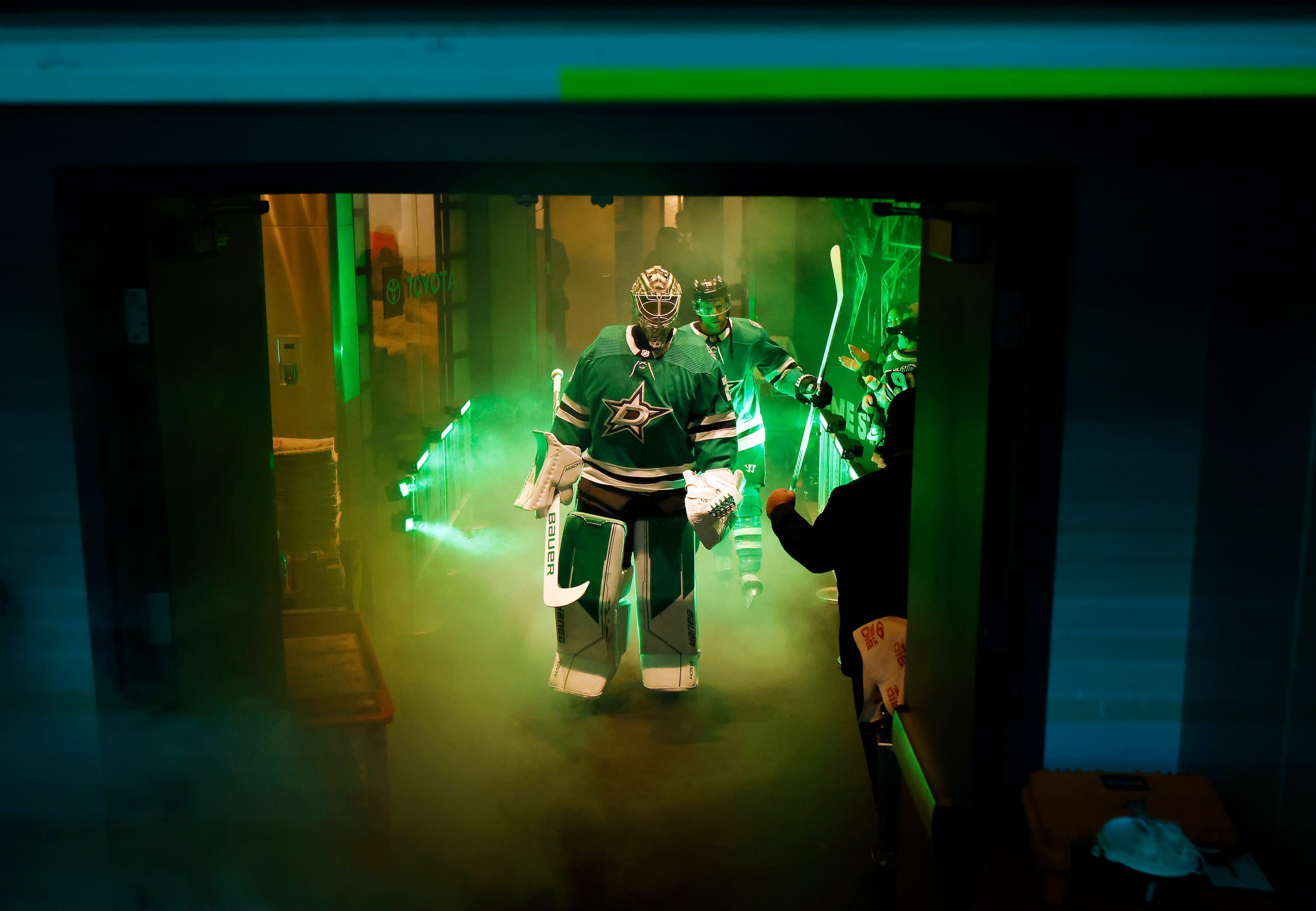 Dallas Stars goaltender Jake Oettinger (29) and center Joe Pavelski (16) marches through the...