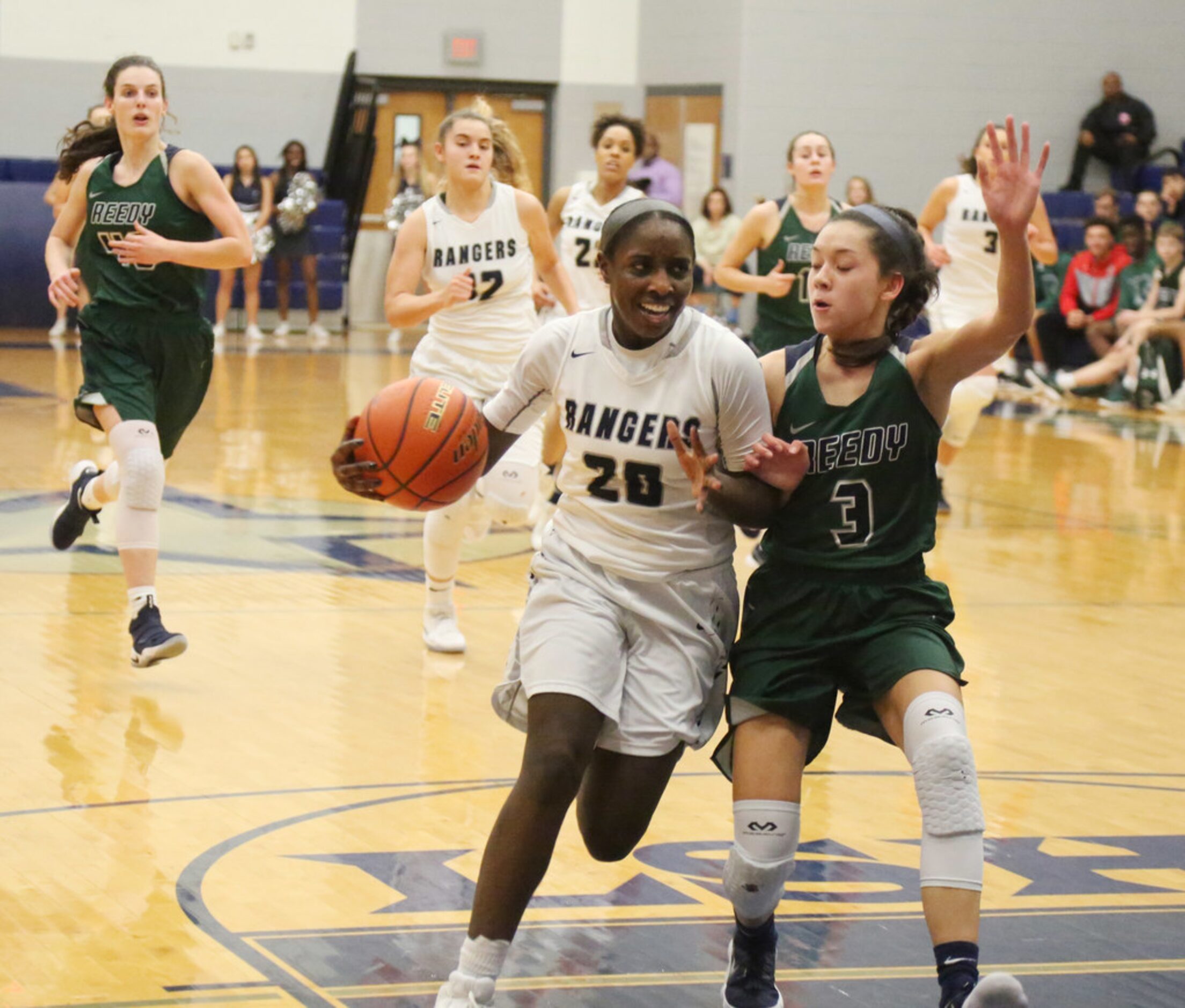 Frisco Lone Star's Leah Harris drives against Frisco 
Reedy's Bella Vu at  District 13-5A...