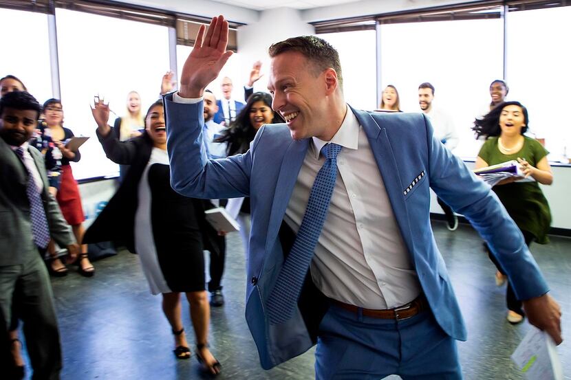 ***FOR TOP 100 - DO NOT USE *** CEO Bart Yates runs to give a team member a high five during...