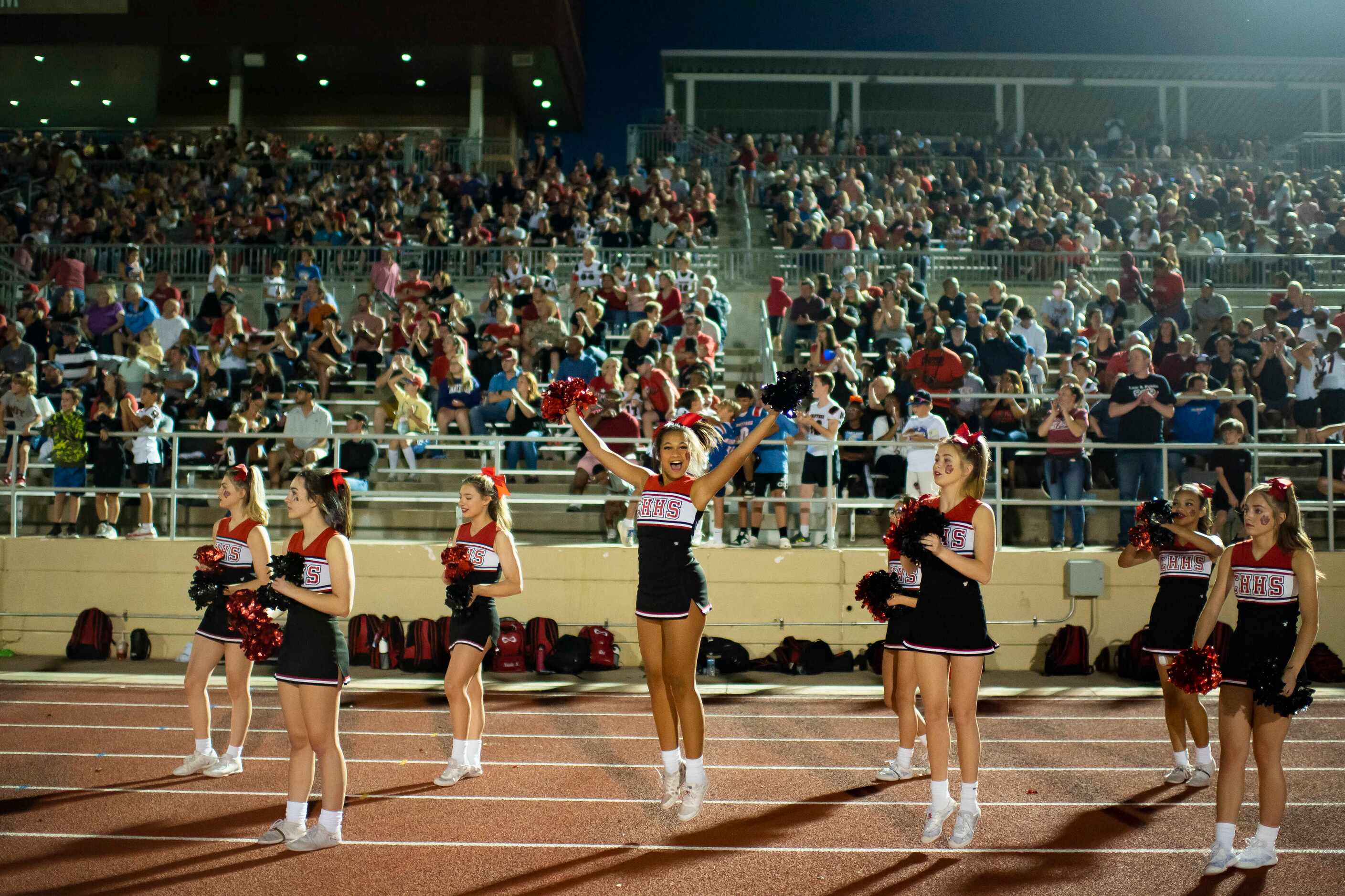 The Colleyville cheerleaders celebrate a first down during a District 4-5A Division II game...
