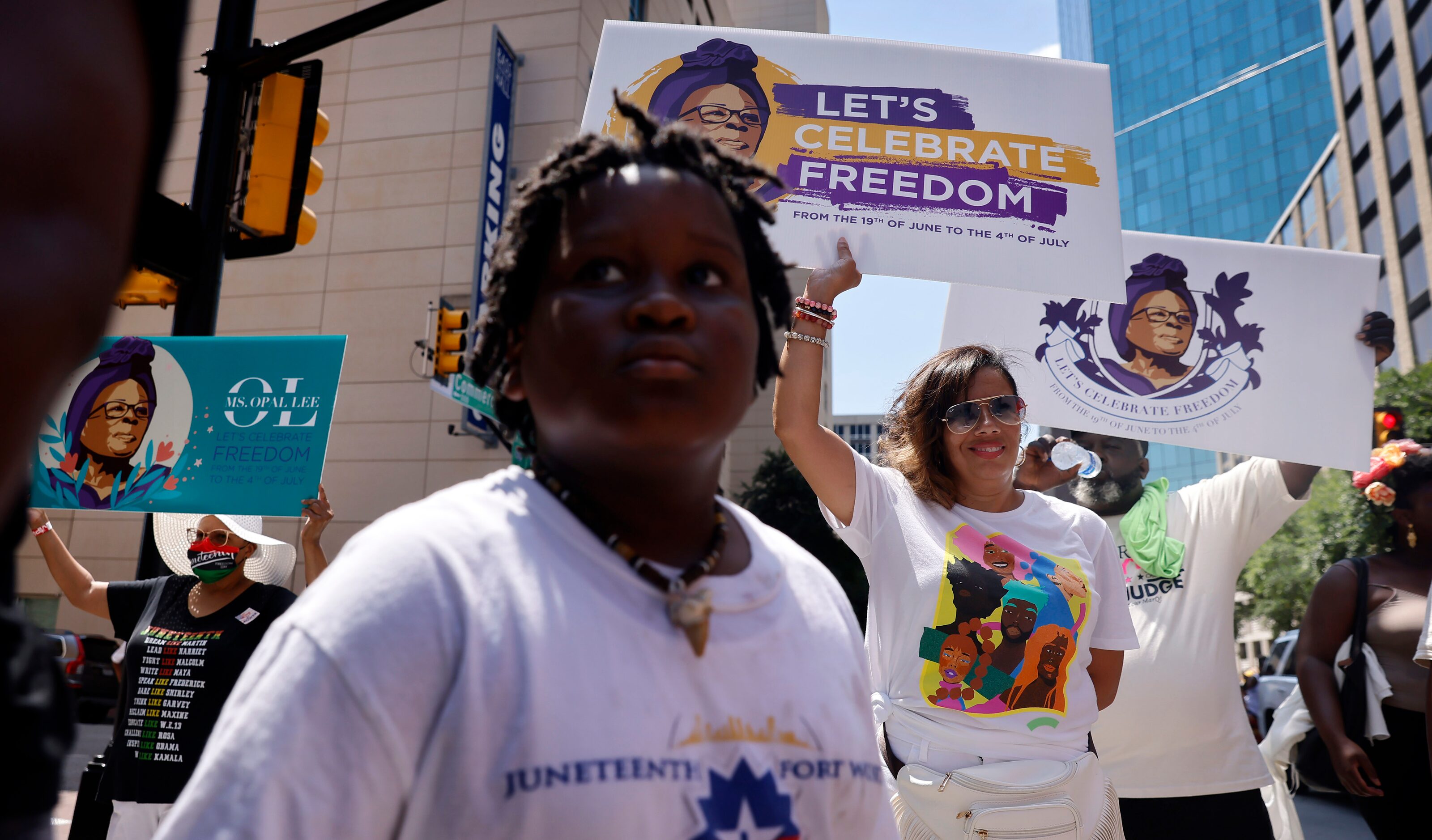 Supporters of Opal Lee and her Juneteenth walk event make the hot holiday trek through...