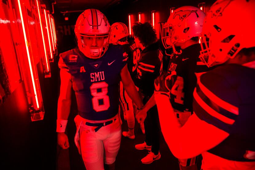 SMU Mustangs quarterback Ben Hicks (8) walks through the tunnel to the field before a...