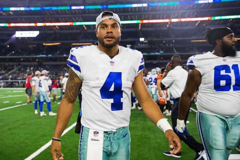 Dallas Cowboys quarterback Dak Prescott (4) leaves the field after an NFL preseason game...