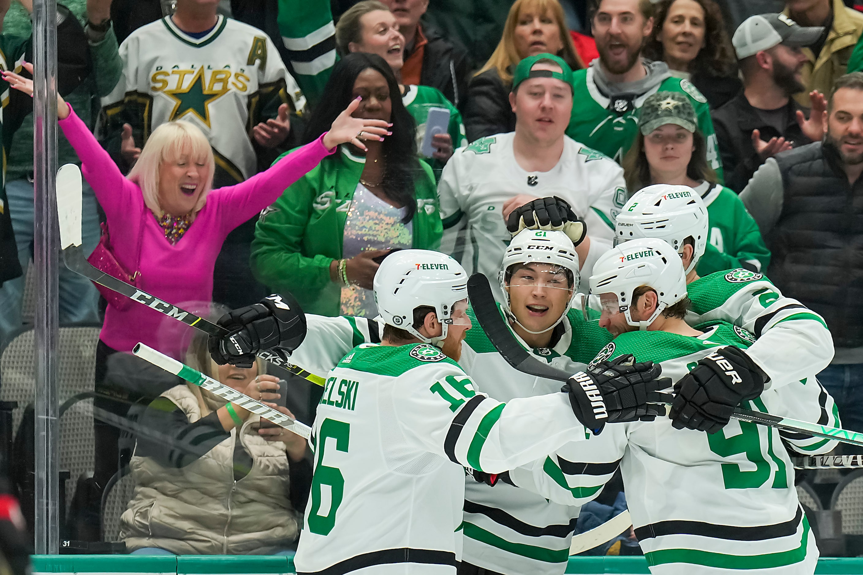 Dallas Stars left wing Jason Robertson (21) celebrates with center Joe Pavelski (16), center...