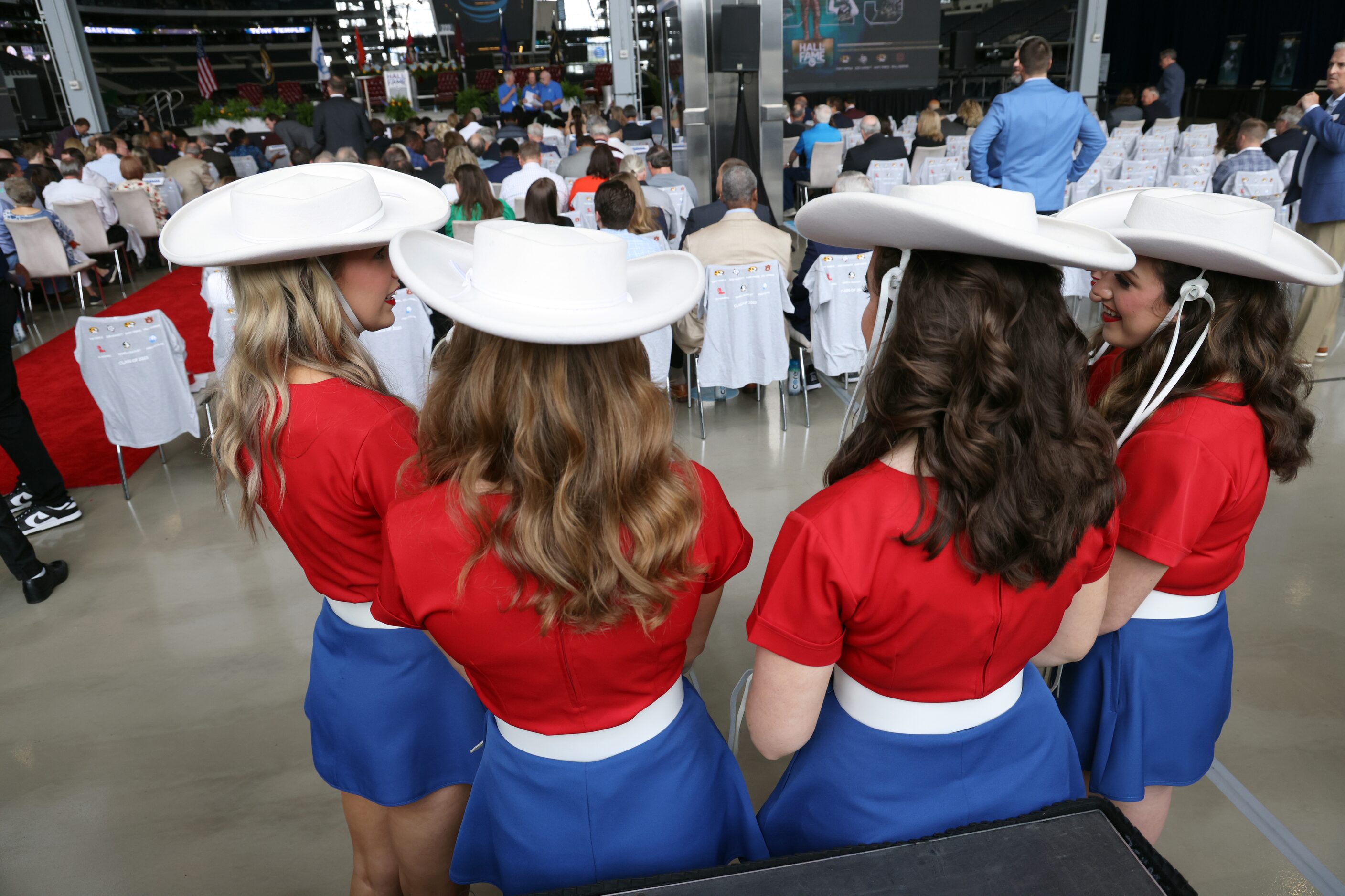 A group go Kilgore Rangerettes await the start of the 2023 Cotton Bowl Classic Hall of Fame...