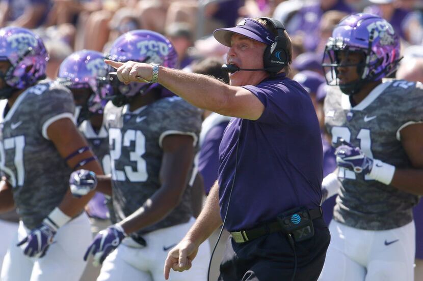 TCU head coach Gary Patterson makes a point as he directs his players during first half...