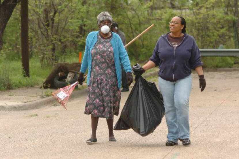 Neighbors in Dolphin Heights, who have worked hard for years to organize, join in a cleanup...