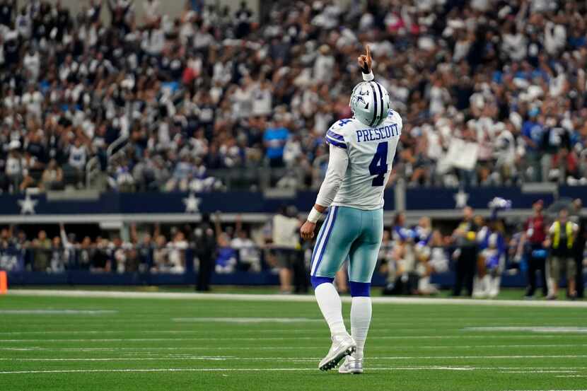 Dallas Cowboys' Dak Prescott celebrates a touchdown during an NFL football game against the...