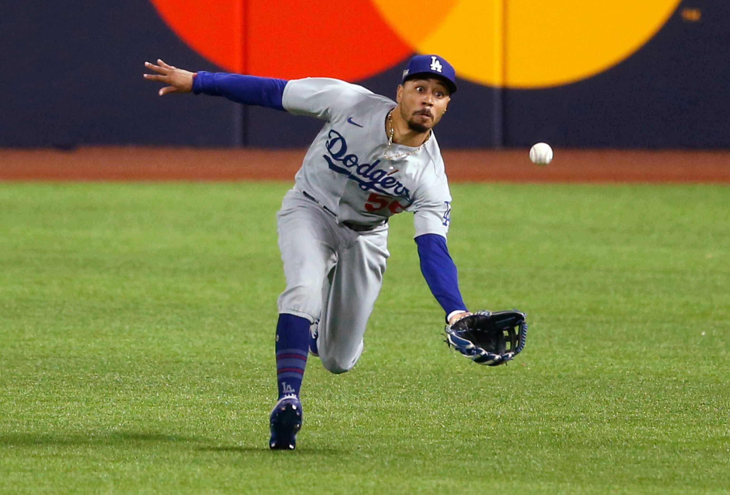 Los Angeles Dodgers right fielder Mookie Betts (50) catches a fly ball hit by Atlanta Braves...