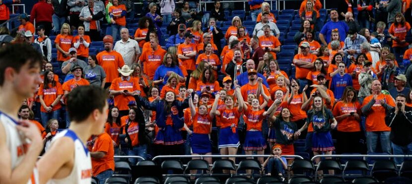 Slidell fans cheer as their team lines up at the end of the game. UIL boys basketball 1A...