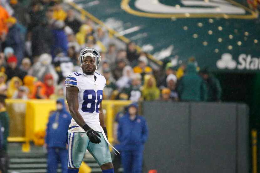 Dallas Cowboys' Dez Bryant walks off the field during the first half of an NFL football game...