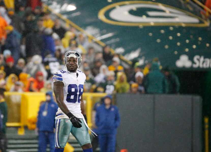 Dallas Cowboys' Dez Bryant walks off the field during the first half of an NFL football game...
