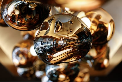 A dazzling chandelier runs the length of the dining room at Joey in Dallas.