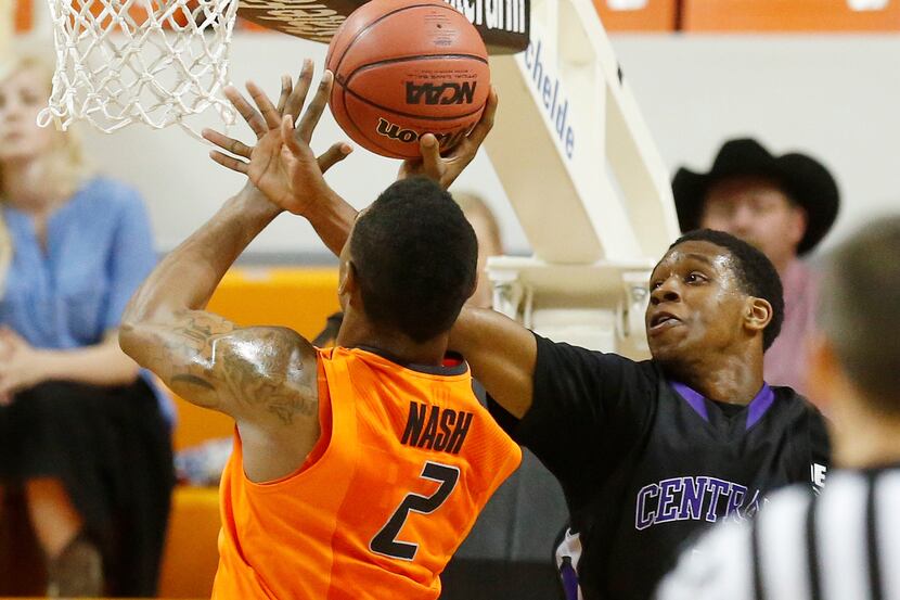Oklahoma State guard Le'Bryan Nash is fouled by Central Arkansas guard Ryan Williams as he...