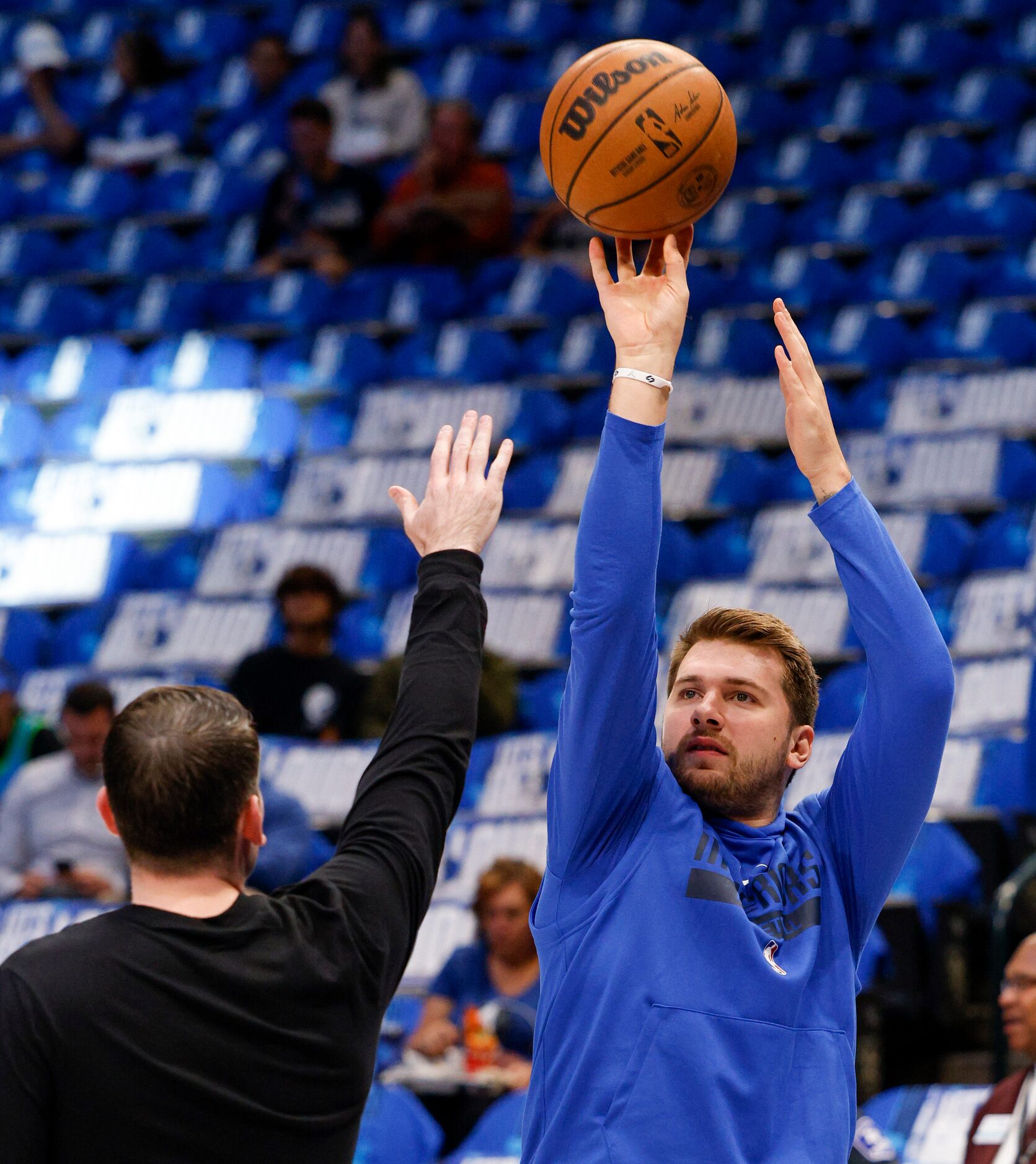 Dallas Mavericks guard Luka Doncic (77) warms up before the Mavs home opener at the American...