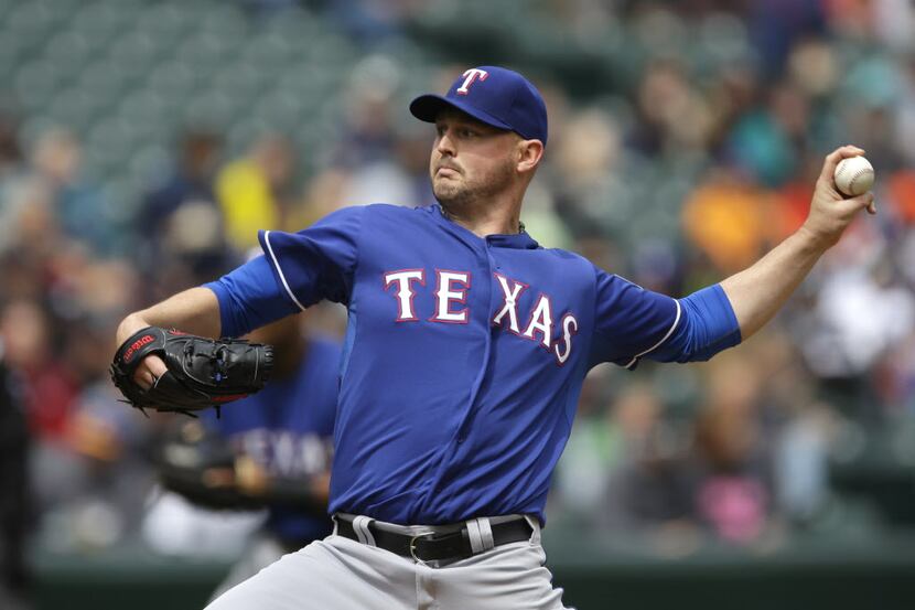 Texas Rangers starting pitcher Matt Harrison throws against the Seattle Mariners during the...