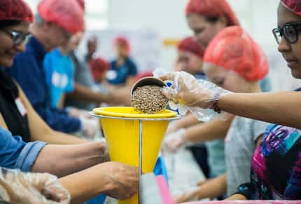 Members of the Ismaili Muslim community and other volunteers, in partnership with Feeding...