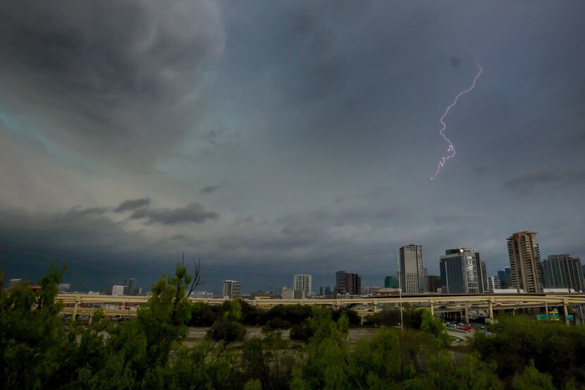 Lighting lights up the sky as storm clouds gather over downtown Dallas on March 16.