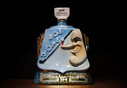 Bob's Steak & Chop House owner Bob Sambol collects golf tournament decanters and has them on...