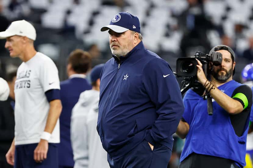 Dallas Cowboys head coach Mike McCarthy walks on the field before an NFL football game...
