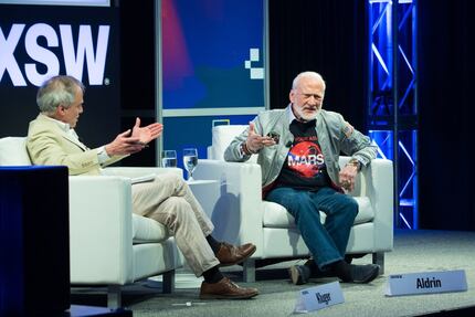 Time Magazine's Jeffrey Kluger (L) and Buzz Aldrin participates in a featured session during...
