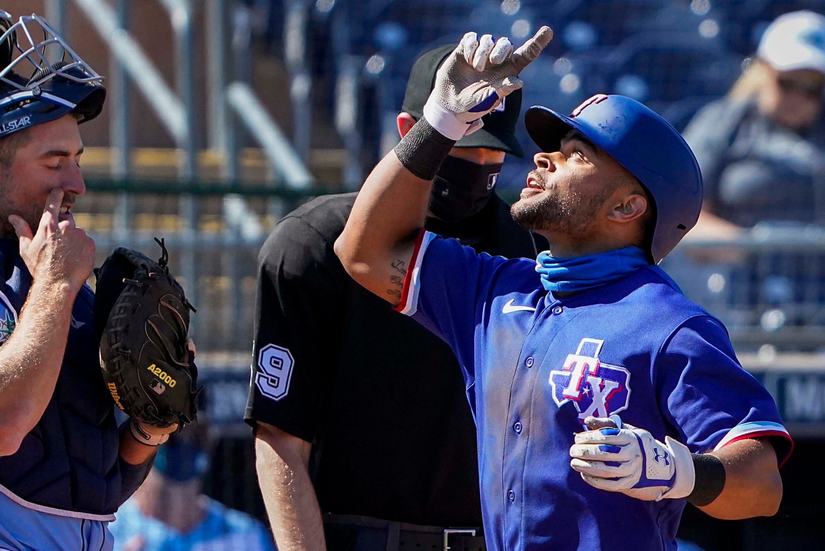 Texas Rangers outfielder Jason Martin celebrates after hitting a solo home run during the...