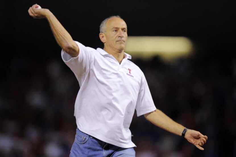 Rangers broadcaster Eric Nadel threw out the ceremonial first pitch before Game 1 of the...