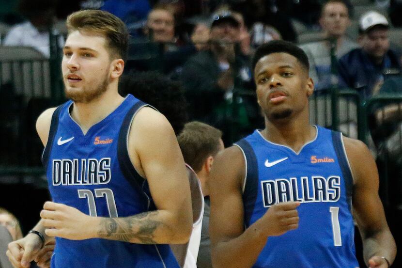 Dallas Mavericks guards Luka Doncic (77), left, and Dennis Smith Jr. (1) are pictured during...