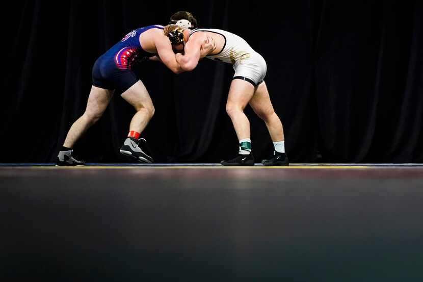 Jarrod Smiley of the University Of Central Florida (facing) wrestled Ethan Martin of Liberty...