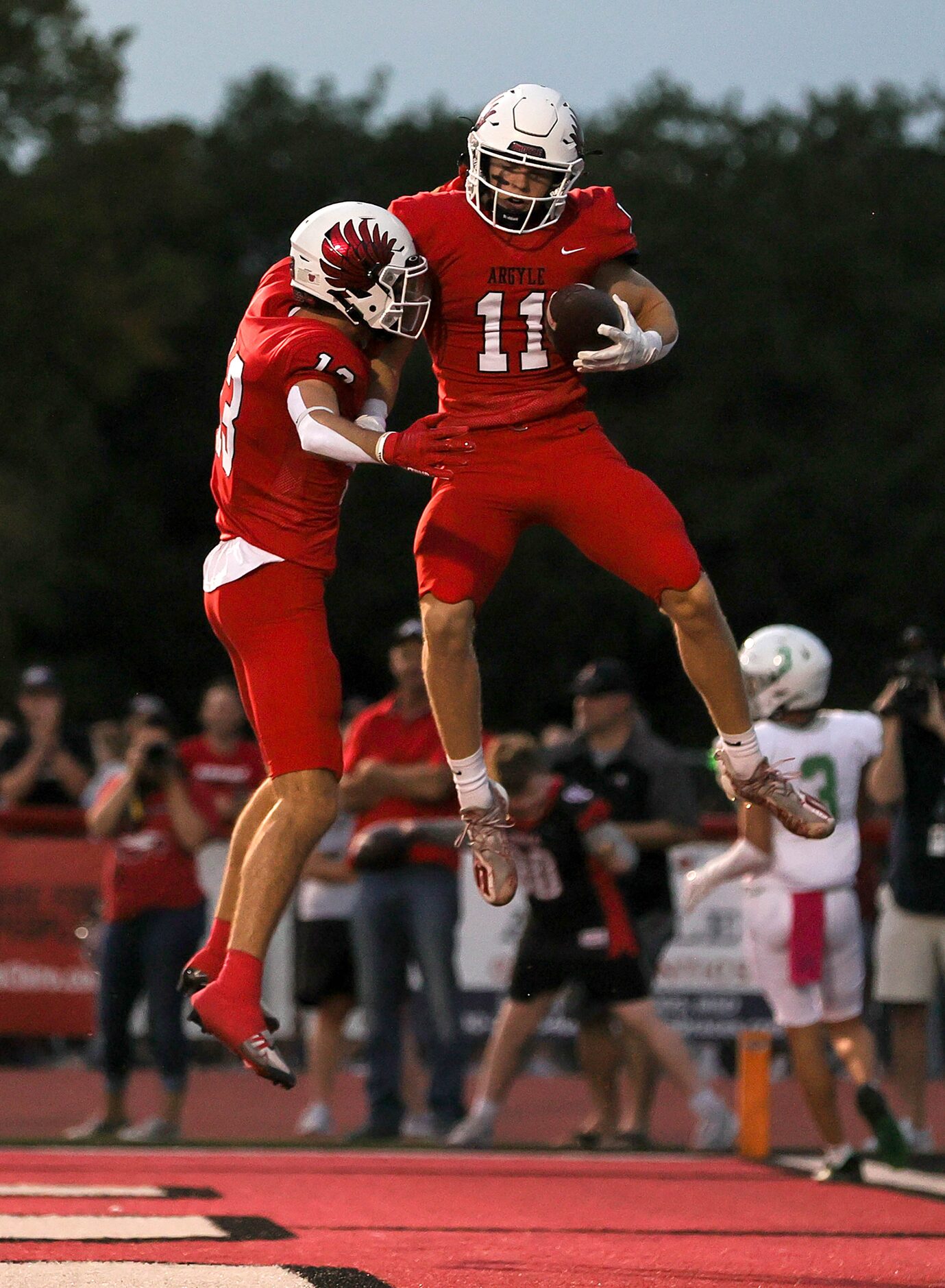 Argyle running back RJ Bunnell (11) and wide receiver Will Krzysiak (13) celebrate after...