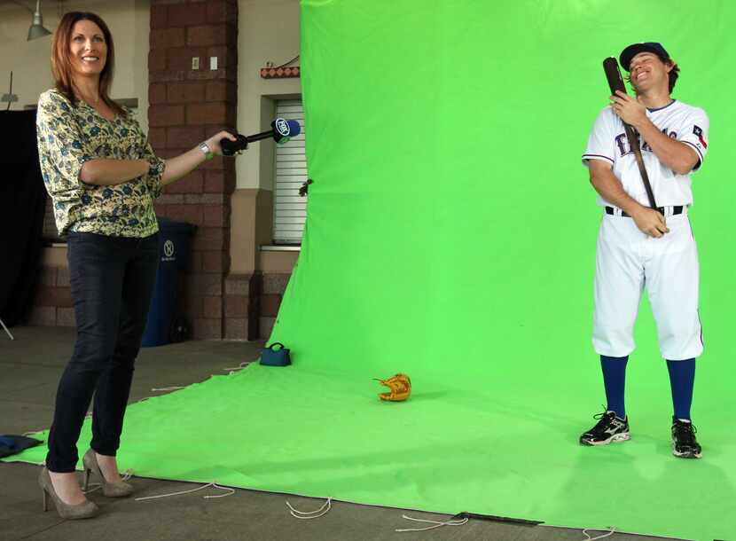 Emily Jones of FOX hole a microphone towards Ian Kinsler as he "loves" his bat at "Picture...
