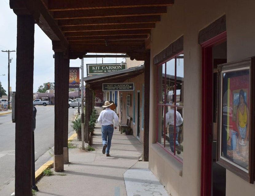 Robert Parsons , owner of Parsons Gallery of the West, strolls past the art galleries along...