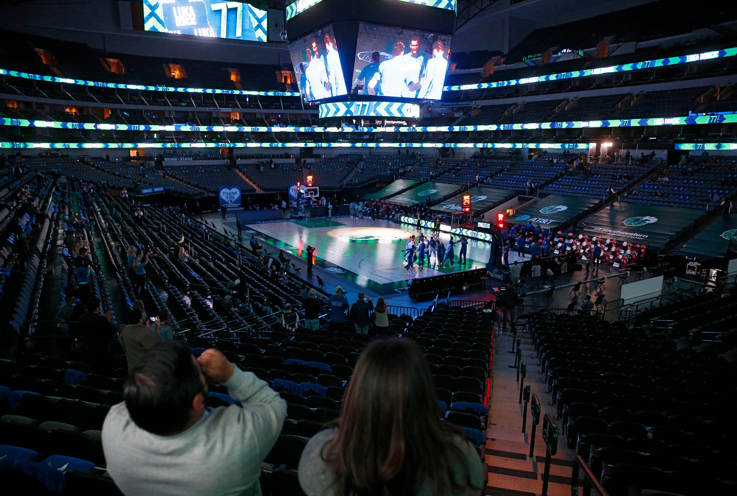 Diego and wife Christi Contreras cheer on the Dallas Mavericks as they are introduced before...