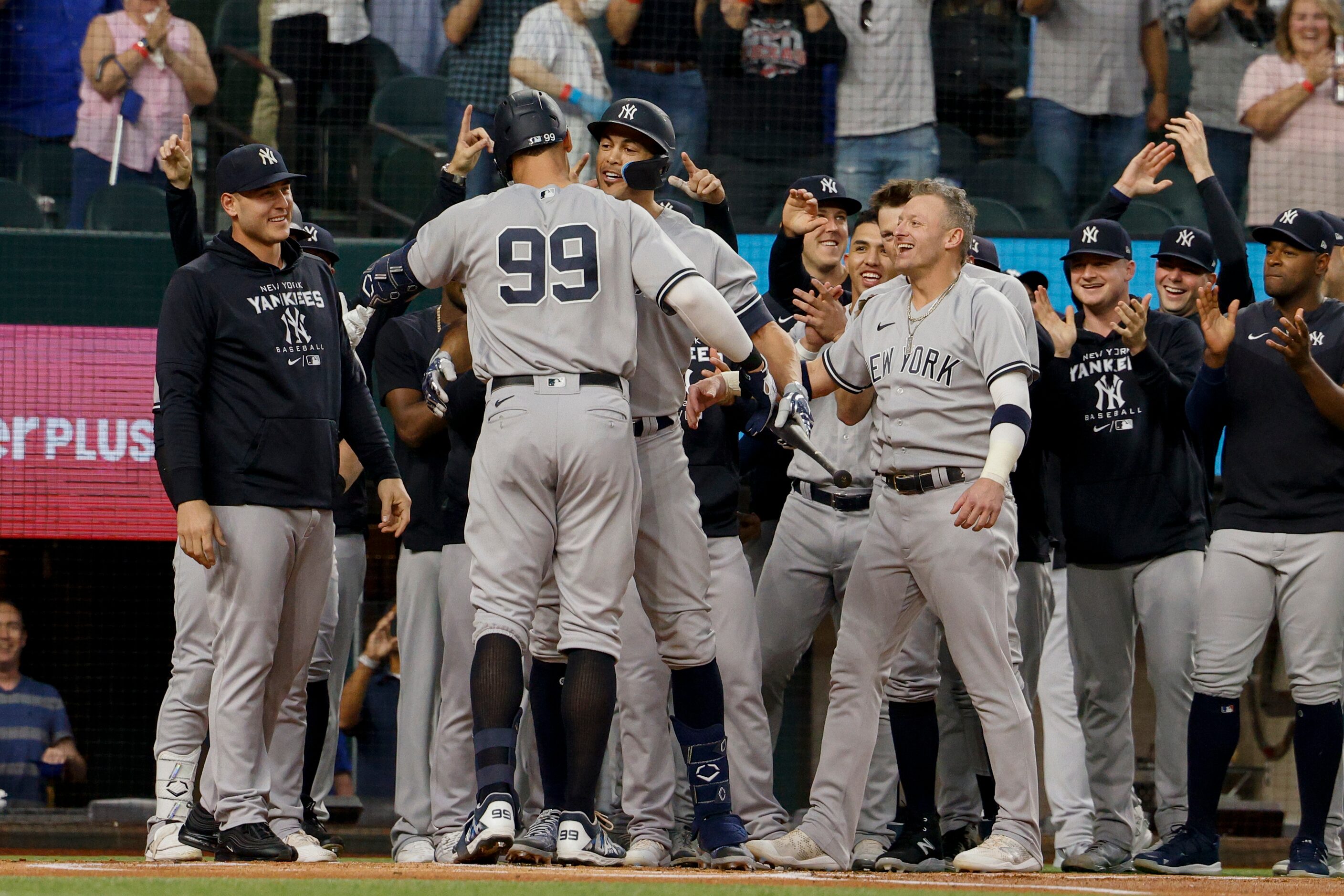 New York Yankees designated hitter Giancarlo Stanton (27) congratulates right fielder Aaron...