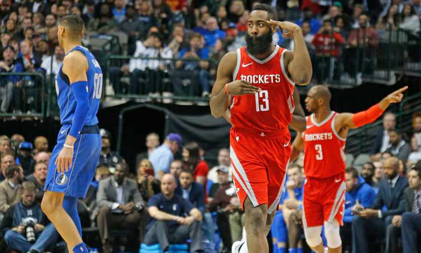 Houston Rockets guard James Harden (13) gestures after hitting a three-pointer in the second...