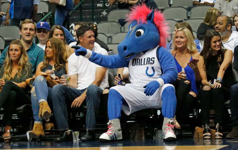 The Mavs mascot sits curtsied with fans during the Houston Rockets vs. the Dallas Mavericks...
