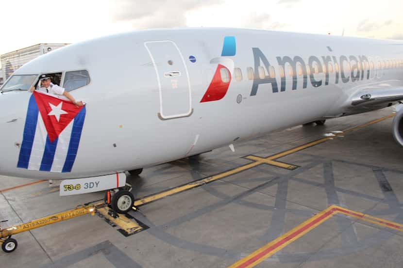  Kevin Mase, an American Airlines pilot, draped a Cuban flag from a Boeing 737 on Dec. 16,...