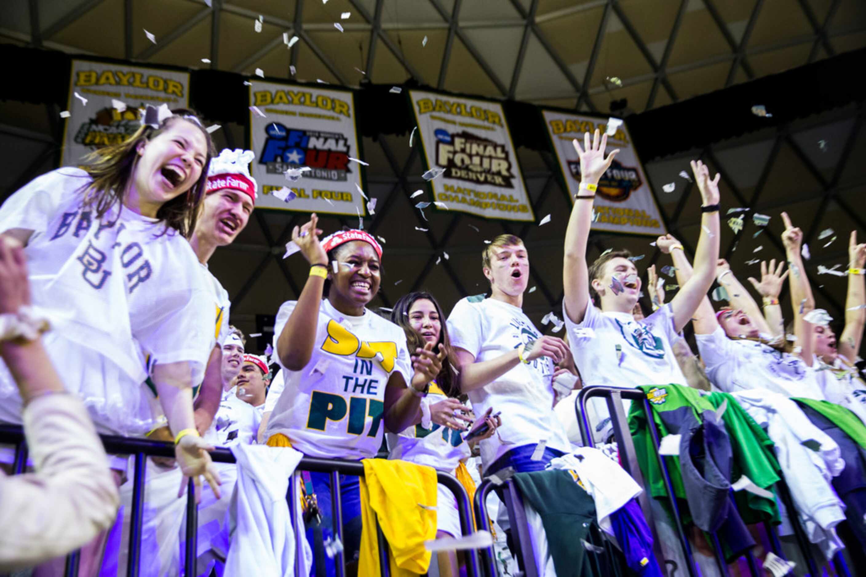 Baylor Bears fans cheer during the first half of an NCAA men's basketball game between...