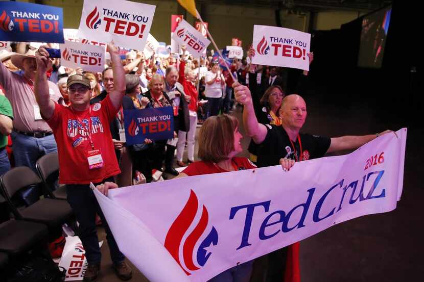
Collin County delegates show their support for Senator Ted Cruz as he speaks to the crowd...