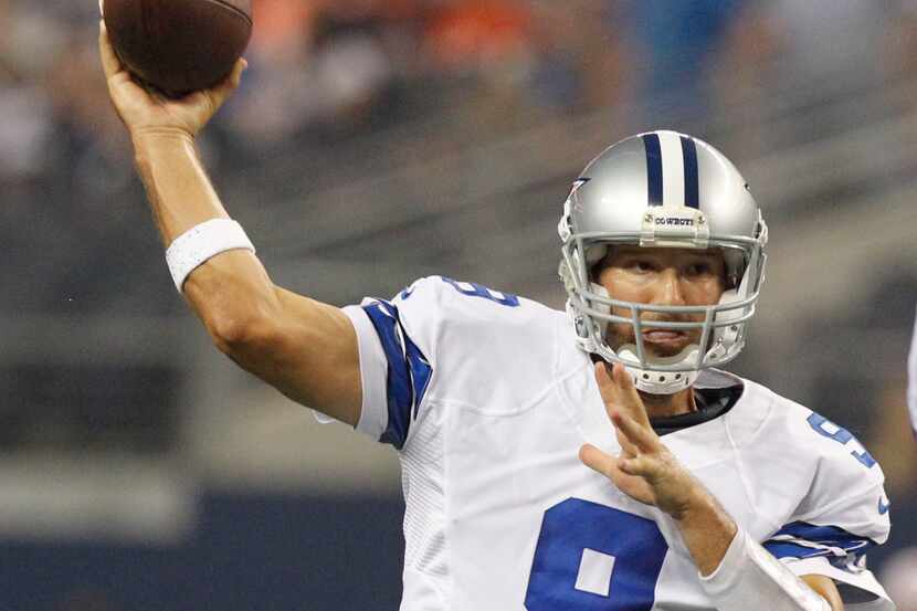 Dallas Cowboys quarterback Tony Romo (9) throws to Dallas Cowboys wide receiver Miles Austin...