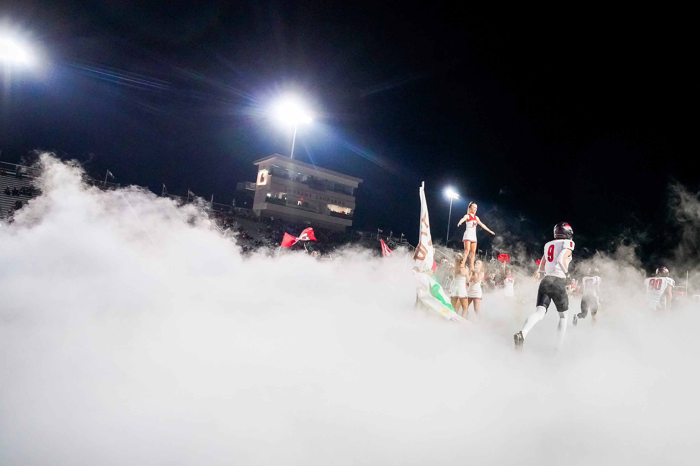 Melissa wide receiver Karson Maynard (9) takes the field with teammates before a District...