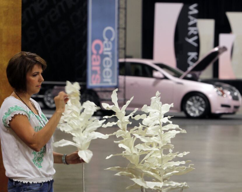 Aimee Henderson of Mary Kay prepared a display at the Dallas Convention Center on Tuesday...