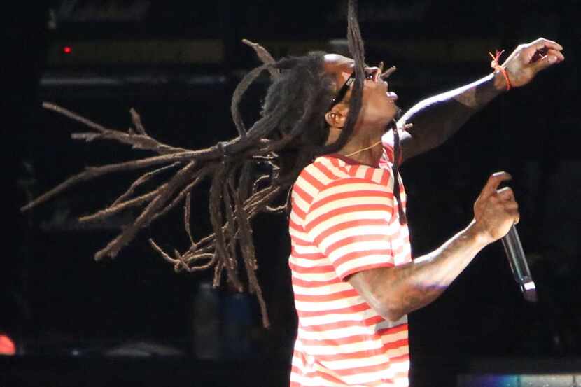 Lil' Wayne's dreads fly in the air during his performance at the World's Most Wanted Music...
