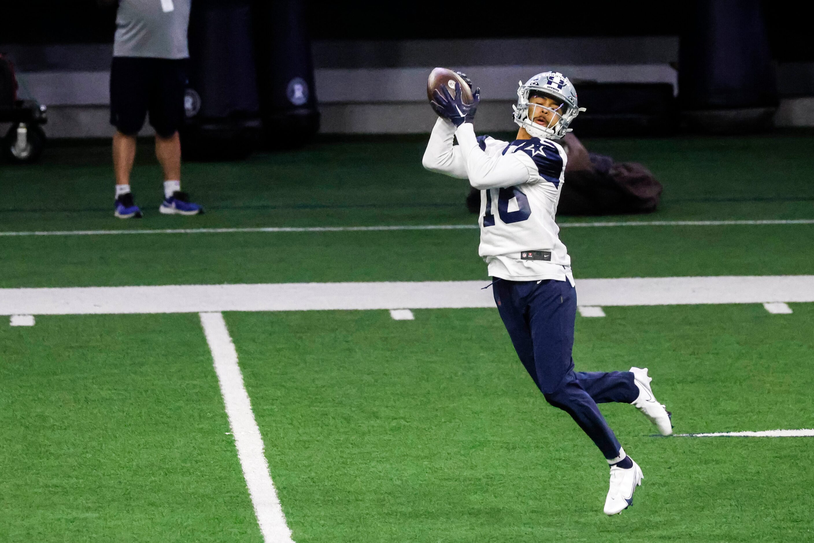 Dallas Cowboys Jalen Moreno-Crooper receives the ball during OTA practice on Thursday, May...