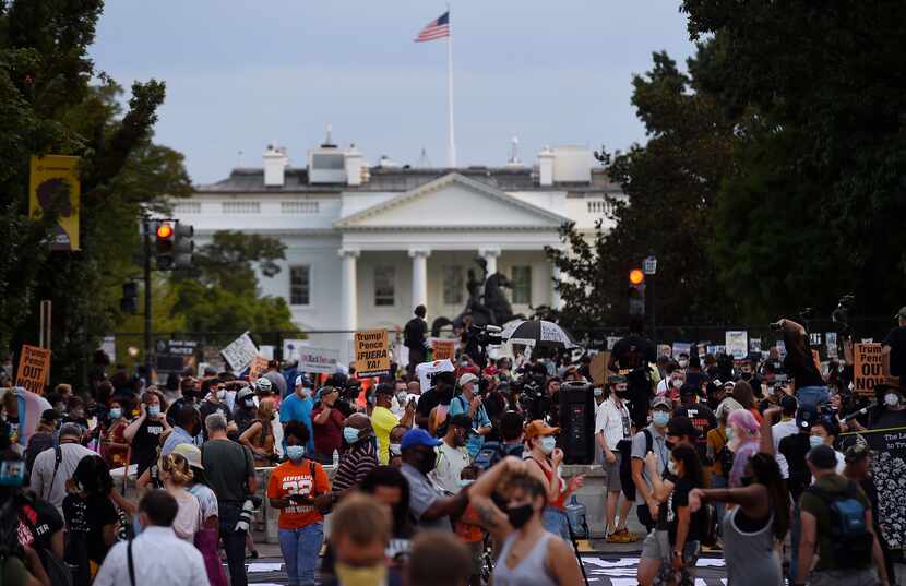 Demonstrators protest President Donald Trump on the final night of the Republican National...