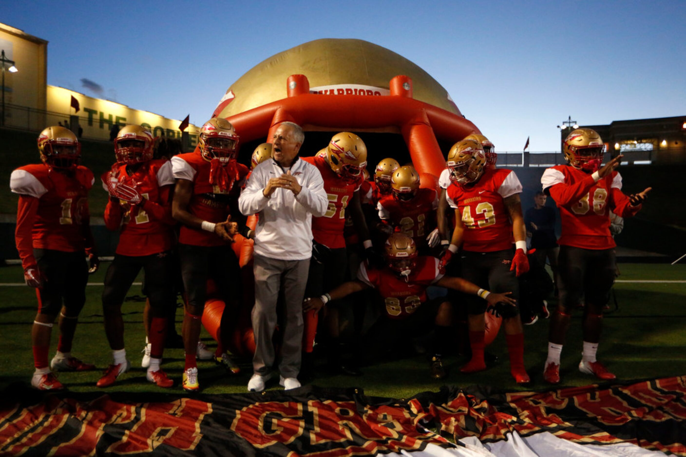 South Grand Prairie's head coach Brent Whitson pumps up his team before their game against...